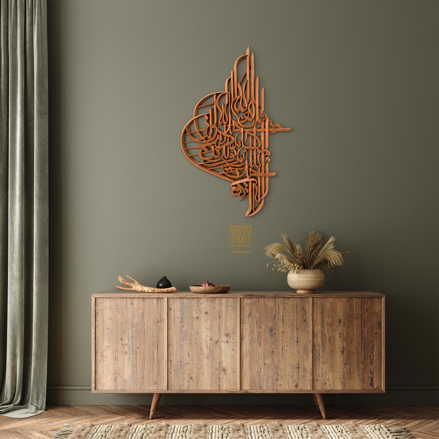 Wooden wall art piece on a green wall above a wooden sideboard.