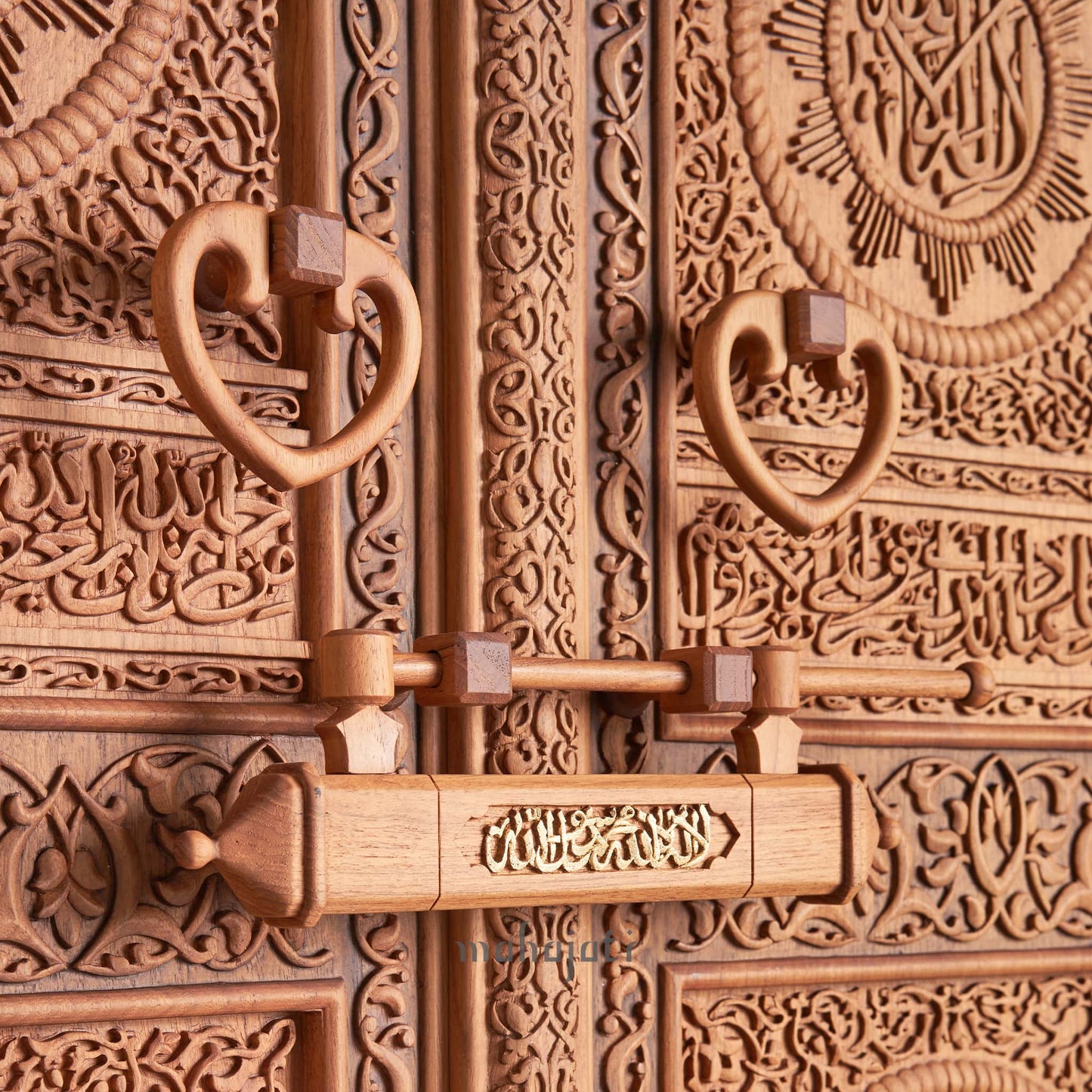 Hand-carved wooden replica of the Mahajati Door of Kaaba, showcasing intricate craftsmanship.