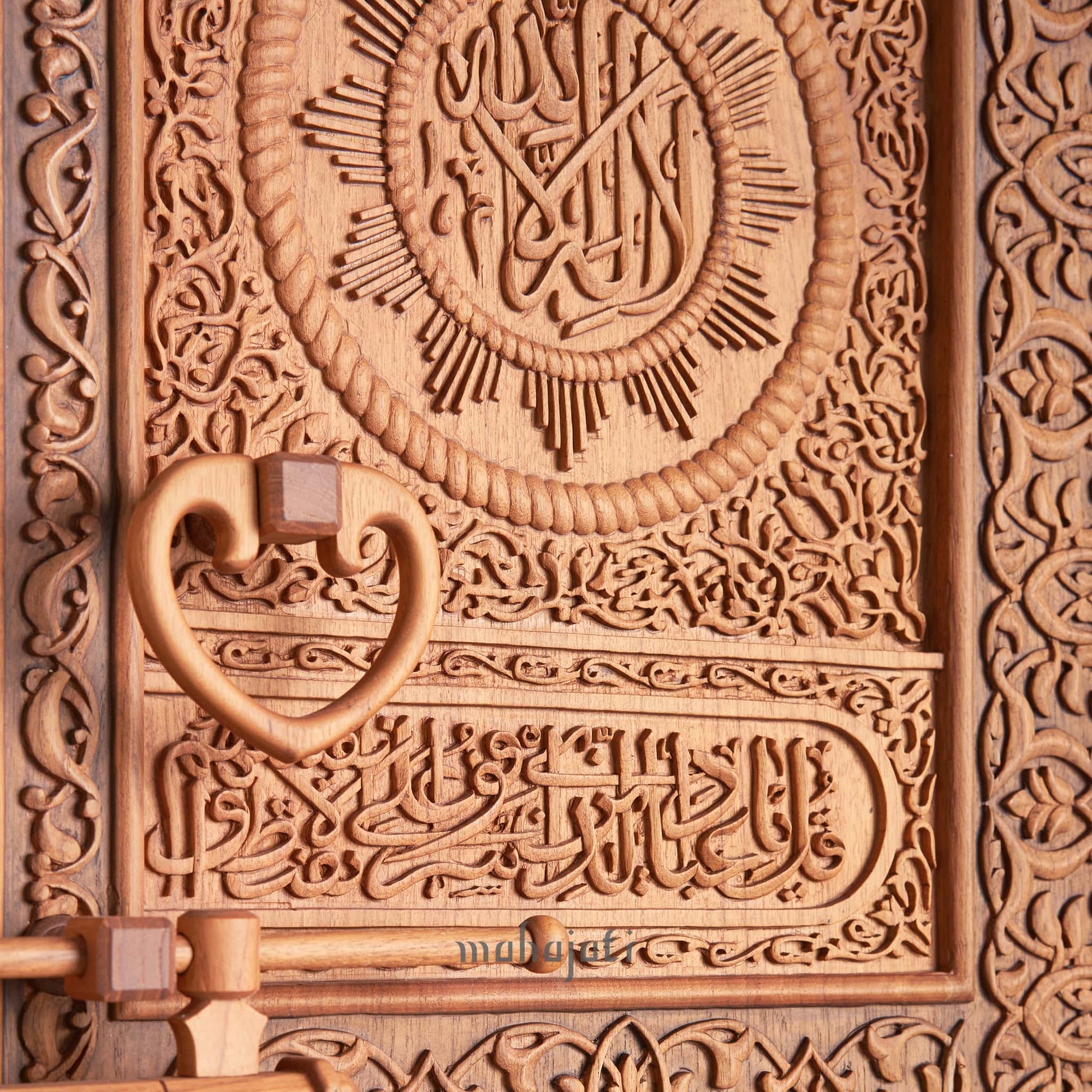 Mahajati’s wooden Kaaba Door replica with detailed hand-carved Islamic motifs.